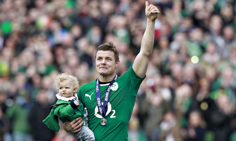 Brian O'Driscoll carries his daughter Sadie at the end of the match