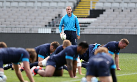 Stuart Lancaster looks on as the England squad are put their paces at Eden Park