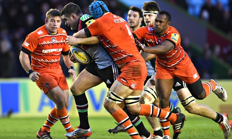 Leicester defenders struggle to hang on to a rampant Nick Easter of Harlequins at The Stoop.