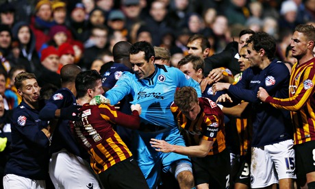 Millwall goalkeeper David Forde elbows Bradford's Billy Knott 