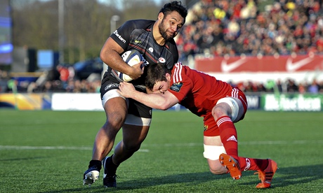 A Munster tackler tries to halt the charge of Saracens' Billy Vunipola.