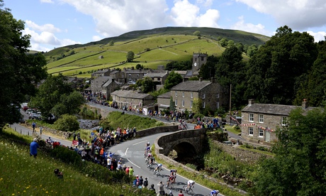 The Peloton passes through the village of Muker, Yorkshire during the 2014 Tour de France