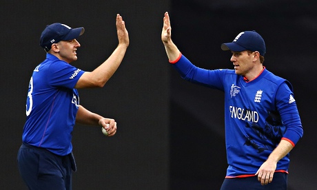 James Tredwell, left, and captain Eoin Morgan celebrate taking an Afghanistan wicket