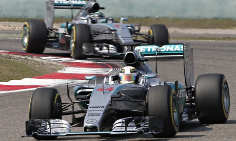 Lewis Hamilton keeps ahead of his Mercedes team-mate Nico Rosberg on the way to victory in Shanghai.