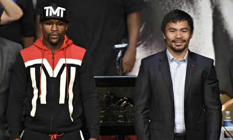 Floyd Mayweather, left, and Manny Pacquiao pose at the MGM Grand in Las Vegas