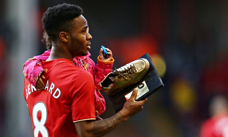 Raheem Sterling with his daughter and a supporters' award 