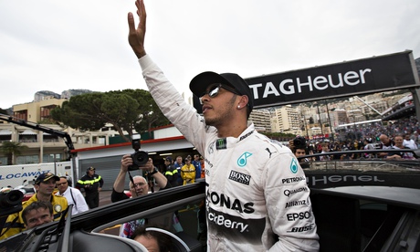 Lewis Hamilton celebrates after beating his Mercedes team-mate Nico Rosberg by three tenths of second