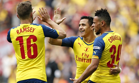 Alexis Sánchez, centre, is congratulated by his Arsenal team-mates Aaron Ramsey and Francis Coquelin