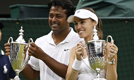 Martina Hingis, right, celebrates her second Wimbledon title in two days with Leander Paes.