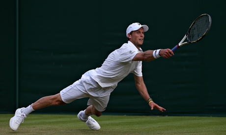 Italy's Andreas Seppi dives as he attemp