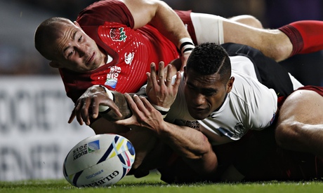 The try that wasn't: Fiji's scrum-half Nikola Matawalu is just foiled by England's Mike Brown.