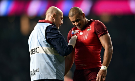  Jonathan Joseph is assessed for an injury during England's victory over Fiji 