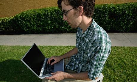 Young man working on laptop computer