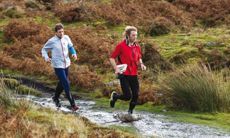 Adharanand Finn and his guide Ceri running across Dartmoor