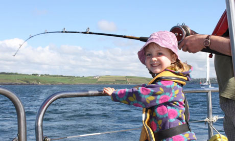 Amélie, Miranda's daughter, fishing off Kinsale