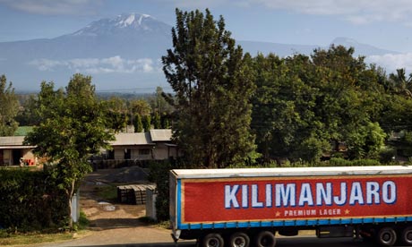 A Kilimanjaro beer truck passes its namesake moutain, Kilimanjaro Region, Tanzania, East Africa.