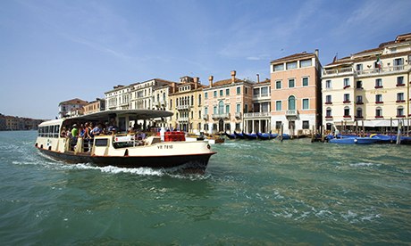 Vaparetto waterbus travelling on the Grand Canal 