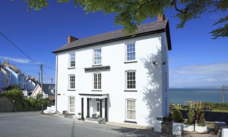 The Black Lion In looms over New Quay.