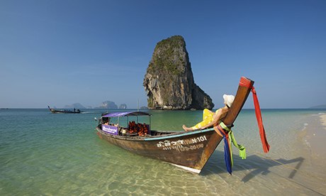 Relaxing on a long-tail boat in Thailand.