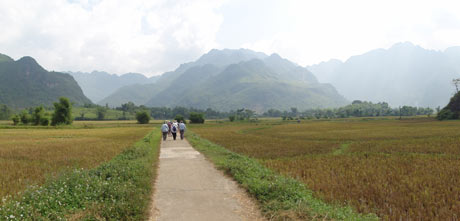 Walking through a village in the Mai Chau region