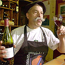 Jacques Melac, owner of a famous Parisian wine bar, tastes a bottle of the newly arrived Beaujolais Nouveau