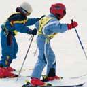 Children learning to ski