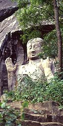 A statue of Buddha at the foot of the mountains in Ulpotha