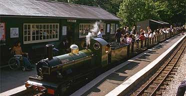Passengers alight from L'Aal Ratty at Dalegarth station