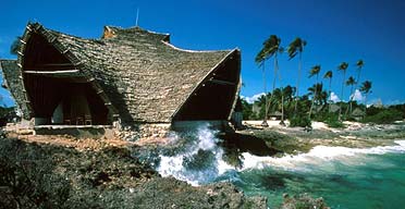 Palm-thatched eco-bungalows on Chumbe Island