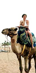 Emma Mahony and daughter on a camel