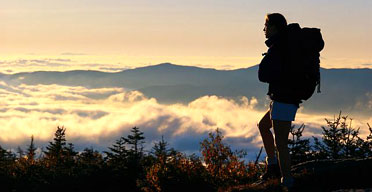 Woman on top of a mountain