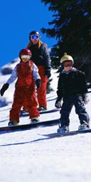 Children snowboarding