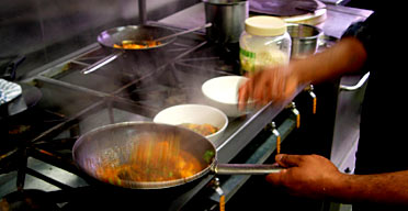 A chef cooking at Bobby's restaurant, Leicester
