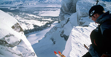 A skier takes a moment to reflect before plunging down Corbet's Couloir