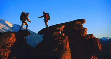 Backpackers climbing
