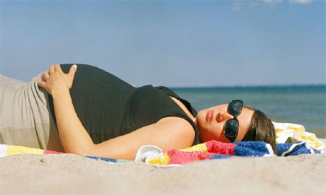 Pregnant woman on the beach