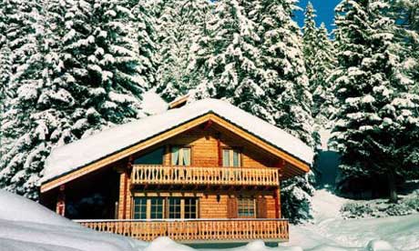 Freshly fallen snow on a Swiss cabin