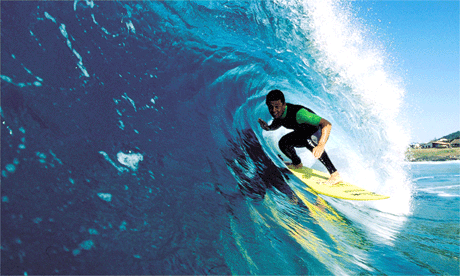 Surfer catching a wave