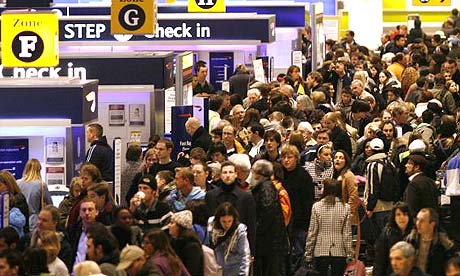 a crowd of people in an airport