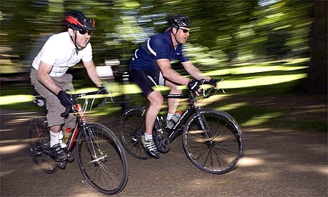Tom Robbins, left, and friend Mike Carter cycling
