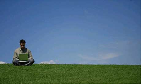 Laptop user in a field