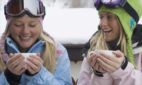 Skiers drinking hot chocolate