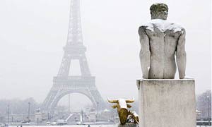A view of the Eiffel tower in snowy Paris, France