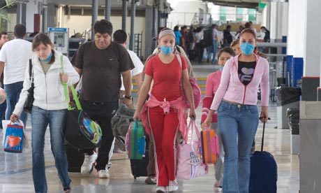 Traveller wearing masks due to the swine flu outbreak in Mexico