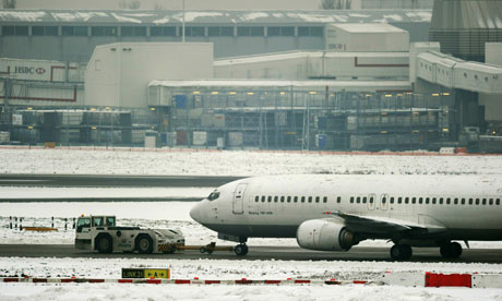 A grounded aircraft in snow at Heathrow