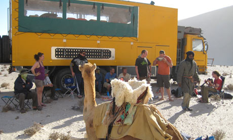 Camel and truck in Libya desert