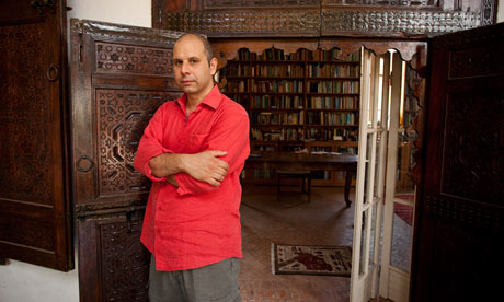 Tahir Shah at the entrance of the library in his house, Dar Khalifa.