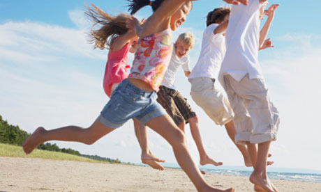 Kids Running and Playing on the Beach