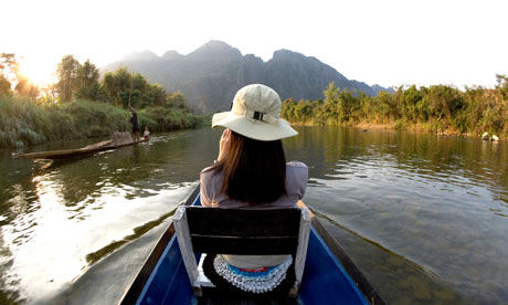 Backpacker on a boat in Laos