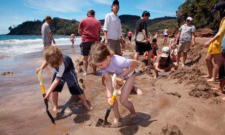 Digging a pool at Hot Water Beach New Zealand.